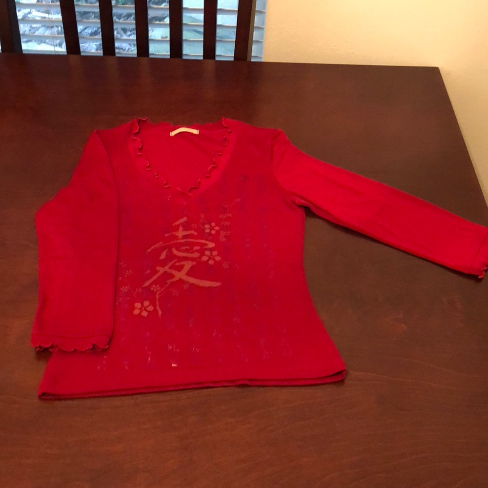 Red woman’s quarter length sleeve shirt